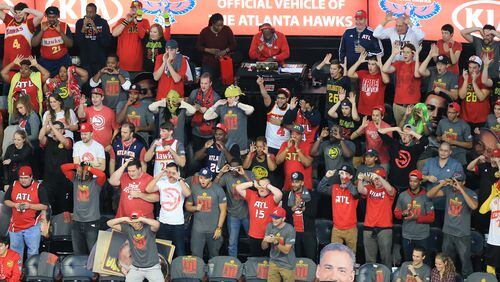 102715 ATLANTA: -- Hawks fans make three point eyes as Kyle Korver plays the Pistons during the first period in their first regular season basketball game "home opener" on Tuesday, Oct. 27, 2015, in Atlanta. Curtis Compton / ccompton@ajc.com