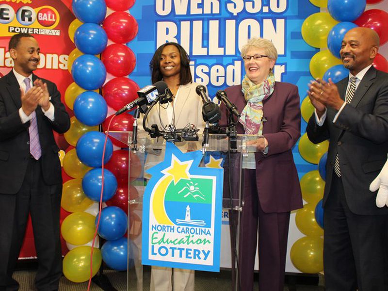 Marie Holmes (second from left) won $88 million (after taxes) in a Powerball drawing.