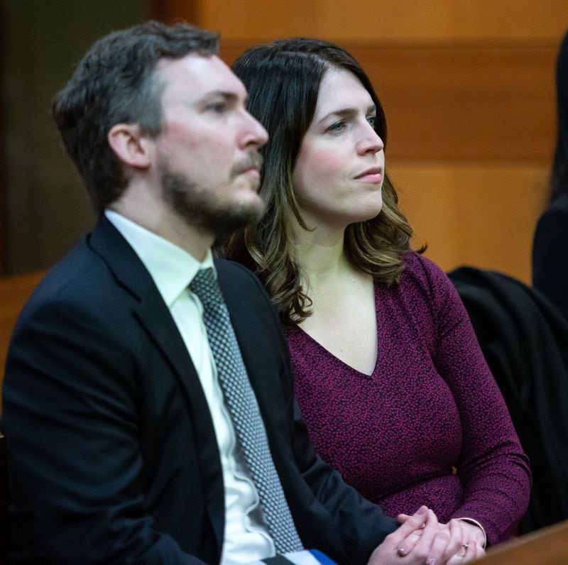 Jenna Garland, right, and her husband, Simeon Spearman, listen to court proceedings during a pre-trial hearing Monday at the Fulton County Courthouse. Garland has been charged with two misdemeanor counts of violating the Georgia Open Records Act. STEVE SCHAEFER / SPECIAL TO THE AJC