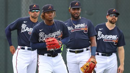 Braves outfielders ready for action: (from left) Nick Markakis, Ronald Acuna, Marcell Ozuna and Ender Inciarte get in some work Wednesday during spring training activities at CoolToday Park in North Port, Fla. (Curtis Compton/ccompton@ajc.com)