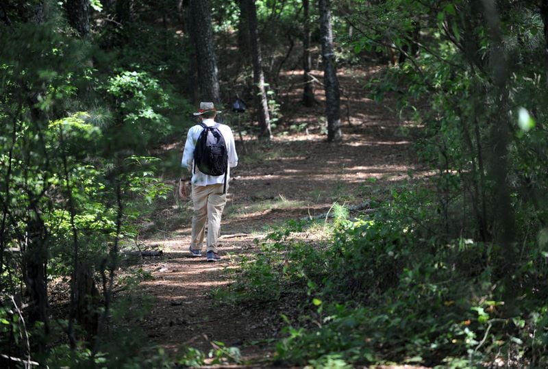 Atlanta Journal-Constitution staff writer Mark Davis walks a trail through DeKalb Memorial Park as he tries to retrace the march that Confederate troops made on the eve of the Battle of Atlanta. KENT D. JOHNSON / KDJOHNSON@AJC.COM