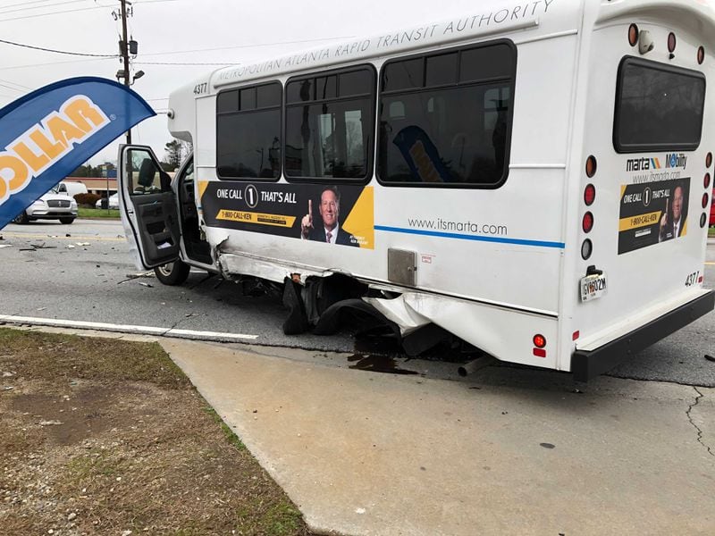 No passengers were on the MARTA Mobility bus when it collided with a minivan near a Clayton County shopping center Tuesday.