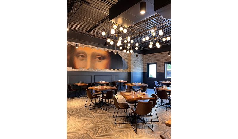 The interior of Grana in Dunwoody features a mural of Mona Lisa's eyes. / Courtesy of Grana