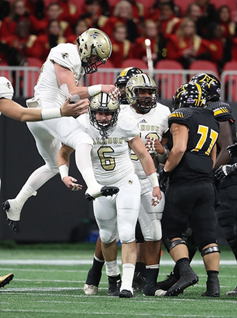  Calhoun linebacker Owen Williams (18) celebrates a defensive play by linebacker Bailey Lester (6) during the Class AAA Championship at Mercedes-Benz Stadium Friday, Dec. 8, 2017, in Atlanta. (Jason Getz/For the AJC)