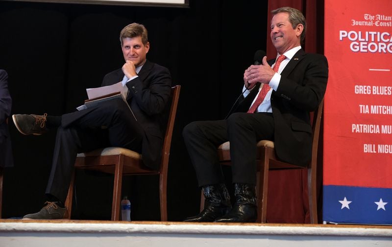 Greg Bluestein listens as Georgia Gov. Brian Kemp speaks during a discussion with "Politically Georgia," a broadcast by the Atlanta Journal Constitution on the University of Georgia campus in Athens on April 18, 2024. (Nell Carroll for The Atlanta Journal-Constitution)