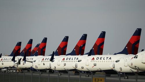 Several dozen mothballed Delta Air Lines jets sit, a sign of how much of the economy has been idled by efforts to slow spread of the coronavirus. (AP Photo/Charlie Riedel)