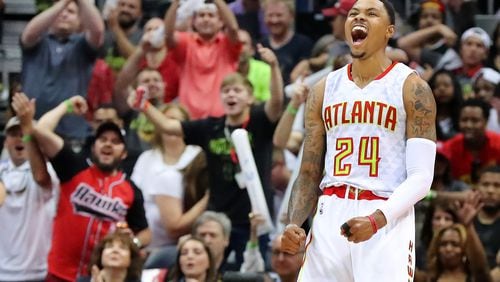 Atlanta Hawks’ Kent Bazemore and fans celebrate as he hits a three pointer against the Wizards during a 116-98 victory in game 3 of a first-round NBA basketball playoff series on April 22, 2017. Curtis Compton/ccompton@ajc.com