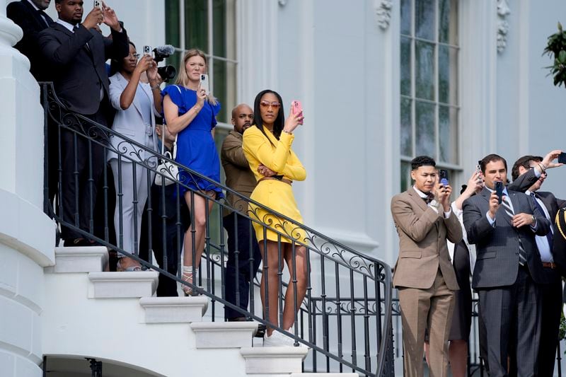A'ja Wilson, of the 2023 WNBA champion Las Vegas Aces, center, waits to watch President Joe Biden walk to board Marine One on the South Lawn of the White House, Thursday, May 9, 2024, in Washington. (AP Photo/Evan Vucci)