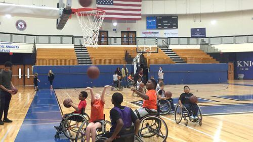 The BlazeSports Junior Hawks practice at Centennial High School, Roswell. The city’s recreation department has been recognized for its work with physically and developmentally disabled children and adults. BLAZESPORTS