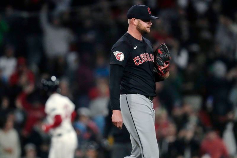 Cleveland Guardians pitcher Ben Lively walks back to the mound, as Boston Red Sox's Connor Wong runs the bases on a home run during the fourth inning of a baseball game Wednesday, April 17, 2024, in Boston. (AP Photo/Charles Krupa)