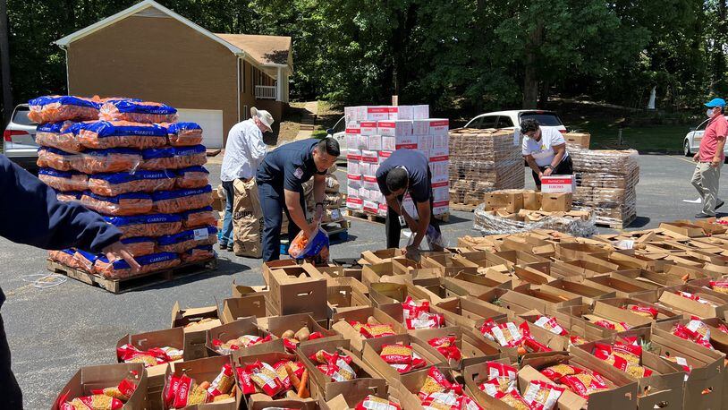 Volunteers help sort food from the Atlanta Food Bank into boxes for Gwinnett's Mobile Food Distribution program. (Courtesy Gwinnett County)
