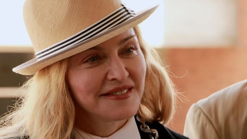 Pop diva Madonna is pictured here at a charity event in Malawi in 2016. The ‘Material Girl’ just released a couple racy photos on Instagram, then took the nude image down.