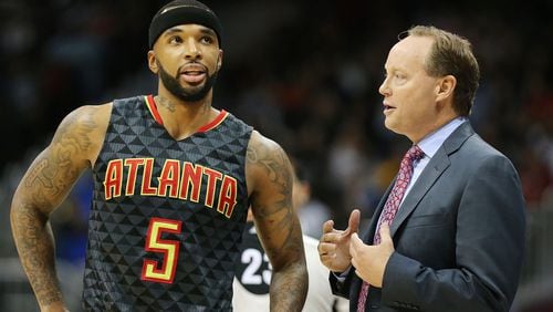 Hawks head coach Mike Budenholzer confers with Malcolm Delaney during the first period against the Lakers in an NBA basketball game at Philips Arena on Wednesday, Nov. 2, 2016, in Atlanta. Curtis Compton /ccompton@ajc.com