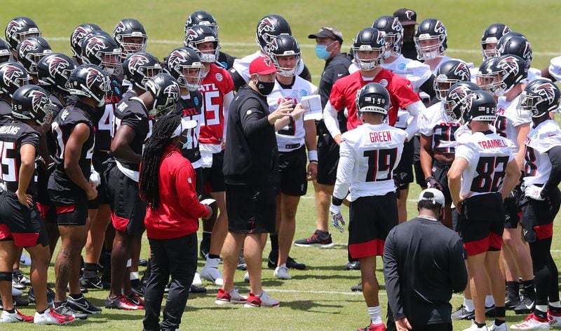 New Falcons head coach Arthur Smith (center) gathers players for some instruction during rookie minicamp Friday, May 14, 2021, in Flowery Branch. (Curtis Compton / Curtis.Compton@ajc.com)