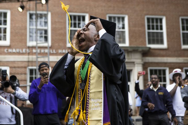 Miles Johnson cheers as he ascends the stage to accept his diploma during the Morehouse College commencement ceremony on Sunday, May 21, 2023, on Century Campus in Atlanta. The graduation marked Morehouse College's 139th commencement program. CHRISTINA MATACOTTA FOR THE ATLANTA JOURNAL-CONSTITUTION