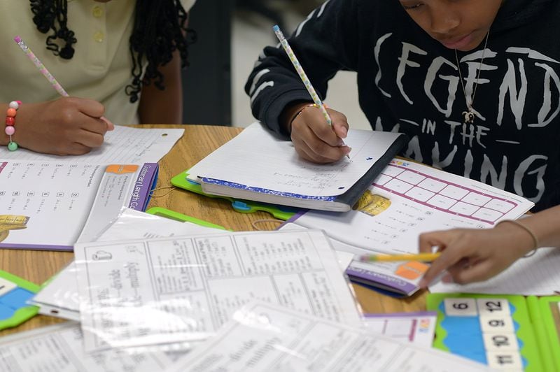 A group of fifth-grade students at Thurgood Marshall Elementary in Morrow, Georgia, work on math problems during class on April 19, 2022. Students across the state will be taking the Georgia Milestones in April and May. (Natrice Miller / natrice.miller@ajc.com)