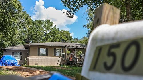 This photo taken Sept 1, 2015, shows the Boulderwoods Drive house where DeKalb police responding to a burglary call entered the wrong home, shot and killed a dog, wounded the homeowner and seriously injured a fellow officer, the GBI said. JOHN SPINK / JOHN.SPINKSR@AJC.COM