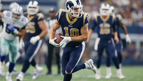 Los Angeles Rams wide receiver Cooper Kupp runs after catching a pass in the fourth quarter against the Dallas Cowboys at AT&T Stadium.
