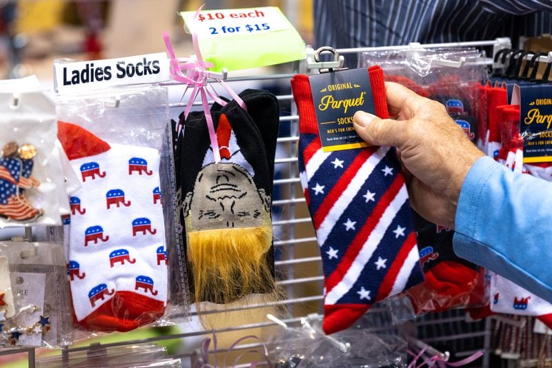 Attendees shop from a booth at the Georgia GOP convention in Columbus on Friday, June 9, 2023. (Arvin Temkar / arvin.temkar@ajc.com)
