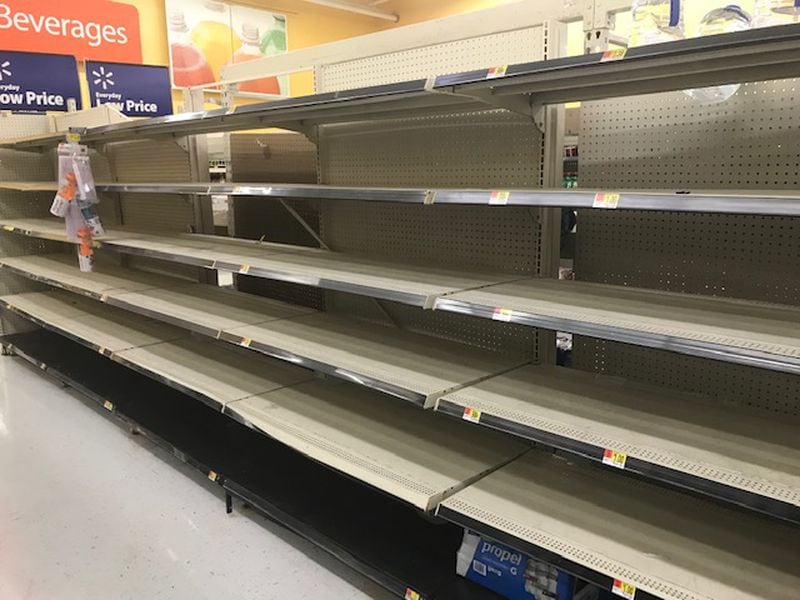 As the rain picked up outside, the Wal-Mart Supercenter in Macon was nearly bone dry inside as shoppers demonstrated a heavy thirst for water late Wednesday afternoon. Christian Boone/AJC
