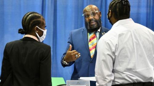 Timothy Hosea, regional manager with Hallmark Aviation Services, meets with job seekers at ATL Airport Career Fair at Georgia International Convention Center on Wednesday, June 30, 2021.  (Hyosub Shin / Hyosub.Shin@ajc.com)