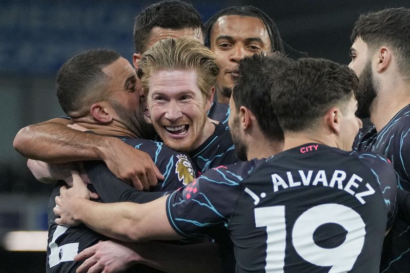 Manchester City's Kevin De Bruyne celebrates with teammates after scoring his side's opening goal during the English Premier League soccer match between Brighton and Manchester City at the Falmer Stadium in Brighton, England, Thursday, April 25, 2024. (AP Photo/Kin Cheung)