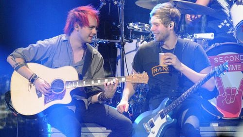 Michael Clifford (left) and Luke Hemmings of 5 Seconds of Summer perform onstage during 93.3 FLZ’s Jingle Ball 2015 Presented by Capital One at Amalie Arena on Dec. 19, 2015, in Tampa, Fla. The band will play at Lakewood on July 24. GERARDO MORA / GETTY IMAGES FOR IHEARTMEDIA