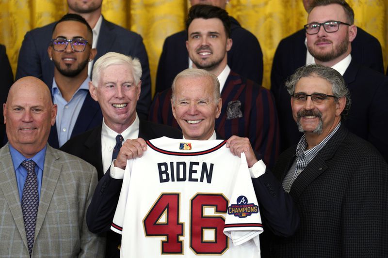 President Joe Biden is presented a jersey as he welcomes the Atlanta Braves to the White House as winners of the 2021 World Series. Boosters aiming to make Atlanta host of the 2024 Democratic National Convention used the event to lobby Biden, who would make the choice. (Yuri Gripas/Abaca Press/TNS)