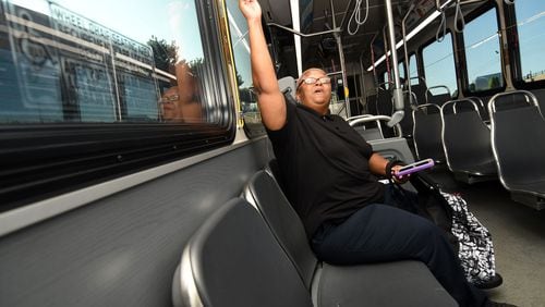 Oneichan Critchlow rides the blue Cumberland Circulator bus in Cobb County on Thursday, August 17, 2017. (Rebecca Breyer)