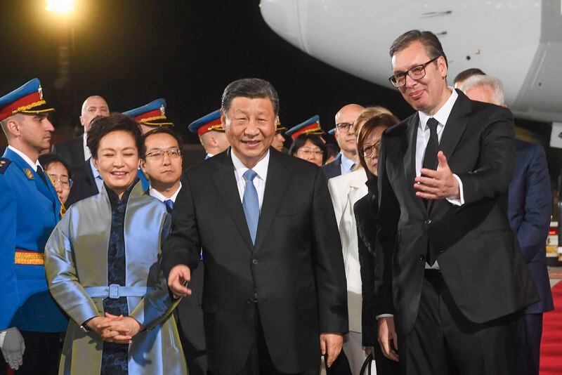 In this photo provided by the Serbian Presidential Press Service, Serbian President Aleksandar Vucic, right, welcomes Chinese President Xi Jinping, center, and his wife Peng Liyuan during a welcome ceremony upon his arrival at the Nikola Tesla airport in Belgrade, Serbia, Tuesday, May 7, 2024. (Serbian Presidential Press Service via AP)