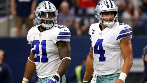 In this Oct. 1, 2017, file photo, Dallas Cowboys running back Ezekiel Elliott (21) and quarterback Dak Prescott (4) walk off the field after an unsuccessful two-point conversion in the second half of an NFL football game against the Los Angeles Rams in Arlington, Texas. The Cowboys already have as many losses as last yearâs NFC East champ, theyâre dogged by anthem questions because of their outspoken owner and their defense looks eerily similar to the lost season of 2015. The bye wasnât offering much of a break from the mental grind of the season. (AP Photo/Ron Jenkins, File)
