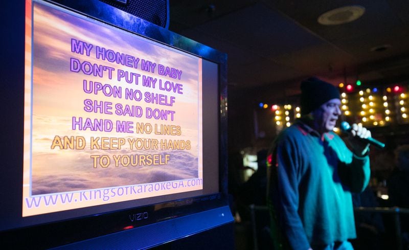 A man sings Karaoke on the screen following the lyrics to a Georgia Satellites song at Chaplins Restaurant and Karaoke Bar in 2017. PHOTO / JASON GETZ