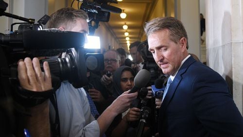 U.S. Sen. Jeff Flake, R-Ariz., who will not run for re-election, answers questions from reporters on Tuesday. Olivier Douliery/Abaca Press/TNS