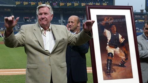 Braves Hall of Famer Del Crandall waves to the crowd after being presented with an drawing of himself in a presentation before game against the Padres Tuesday, Aug. 12, 2003, at Turner Field in Atlanta. (Phil Skinner/AJC)