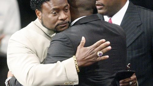 LITHONIA, GA - SEPTEMBER 26: Bishop Eddie Long (L) embraces a friend, at the New Birth Missionary Baptist Church September 26, 2010 in Atlanta, Georgia. Bishop Eddie Long, the pastor of a Georgia megachurch was accused of sexual coersion by three men whom were members of the New Birth Missionary Church. Long has said that he denies all the allegations and that all people must face painful and distasteful situations. (Photo by John Amis-Pool/Getty Images)