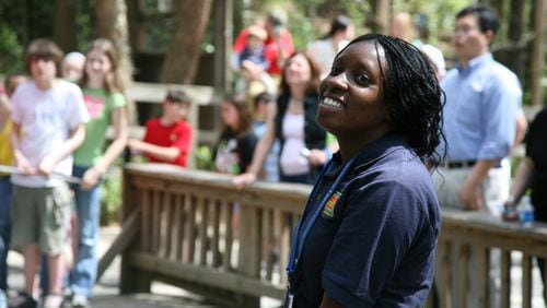 The job fair at Zoo Atlanta will give prospective employees an opportunity to apply for seasonal positions, including work as a rides attendant. Here, a zoo worker helps children at the Safari Slide and rock-climbing wall. Photo: courtesy Zoo Atlanta