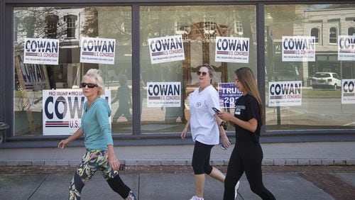 Signs promoting Dr. John Cowan’s campaign in the 14th Congressional District’s GOP primary plaster the window of a business on Broad Street in historic downtown Rome. Cowan appeared to fall short Tuesday in his GOP runoff race with Marjorie Taylor Greene. (ALYSSA POINTER / ALYSSA.POINTER@AJC.COM)