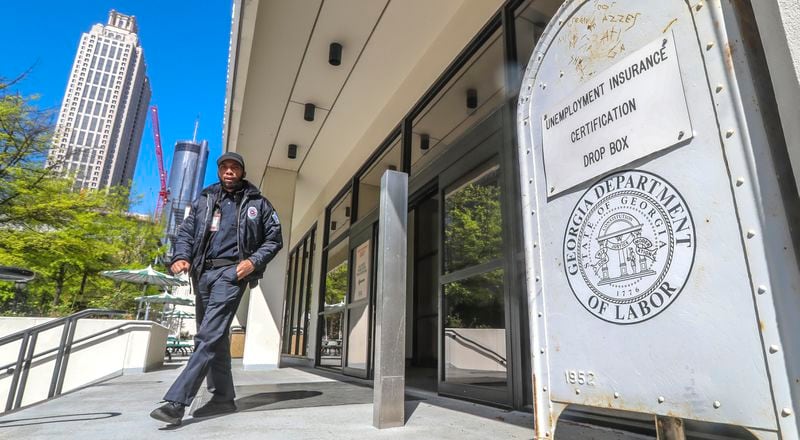 April 2, 2020 Atlanta: A security guard at the Georgia Department of Labor at 223 Courtland St NE in Atlanta walks past the unemployment certification drop box in front of the office on Thursday, April 2, 2020. Unemployment claims have skyrocketed since the COVID-19 pandemic has shut down businesses across the state and country. Georgiaâs coronavirus cases surpassed 5,000 Thursday, and the number of deaths across the state continue to grow. The latest data from the Georgia Department of Public Health shows 5,348 confirmed cases, an increase of about 13% from the 4,748 cases reported Wednesday night. Nine more Georgians have died as a result of COVID-19, the disease caused by the novel coronavirus, bringing the stateâs death toll to 163. Wednesday night. Of all that have tested positive since the outbreak began, 1,056 are hospitalized Thursday, according to the health department.  Amid predictions of a steep increase in cases and with plans in place to increase daily testing capacity, officials say those numbers could balloon in the coming weeks. Scientific projections suggest the state will see thousands of new cases and hundreds of additional deaths before the virus is contained. JOHN SPINK/JSPINK@AJC.COM