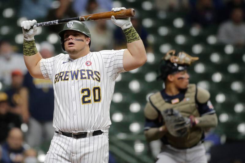 Milwaukee Brewers' Daniel Vogelbach reacts after striking out during the first inning of the team's baseball game against the Atlanta Braves on Saturday, May 15, 2021, in Milwaukee. (AP Photo/Aaron Gash)