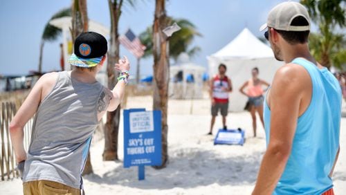 GULF SHORES, AL - MAY 19:  Festivalgoers play cornhole at the 2017 Hangout Music Festival on May 19, 2017 in Gulf Shores, Alabama.  (Photo by Matt Winkelmeyer/Getty Images for Hangout Music Festival)