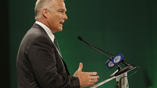 Miami head coach Mark Richt answers a question during a news conference at the NCAA Atlantic Coast Conference college football media day in Charlotte, N.C., Wednesday, July 18, 2018. (AP Photo/Chuck Burton)