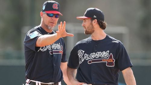 Braves recently elected Hall of Fame third baseman Chipper Jones works with infielder Charlie Culberson at spring training during the first full squad workout on Monday, Feb 19, 2018, at the ESPN Wide World of Sports Complex in Lake Buena Vista. Jones was helping coach the team for the day.     Curtis Compton/ccompton@ajc.com