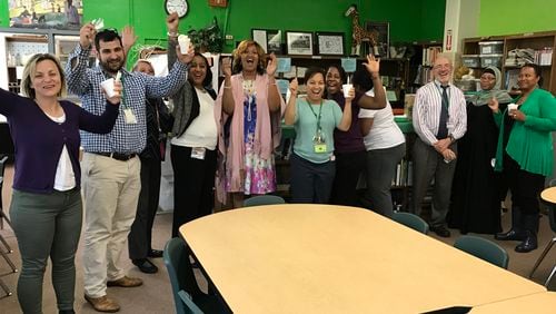 Ashford Park Elementary staff celebrate the school’s STEM certification.