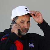Braves general manager Alex Anthopoulos takes a phone call during the first day of team practice at spring training on Monday, March 14, 2022, in North Port.   “Curtis Compton / Curtis.Compton@ajc.com”