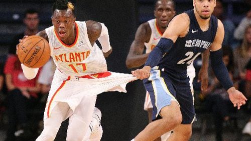 Grizzlies rookie Dillon Brooks tried to hold back Dennis Schroder from a run out. (Curtis Compton/ccompton@ajc.com)