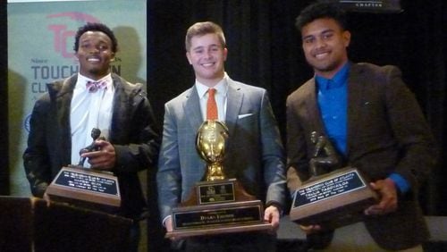Top awards at the Touchdown Club of Atlanta's annual awards banquet Thursday night went to (from left) Nakobe Dean of Horn Lake, Miss., Dylan Fromm of Warner Robins and Taulia Tagovailoa of Thompson High School in Alabaster, Ala.
