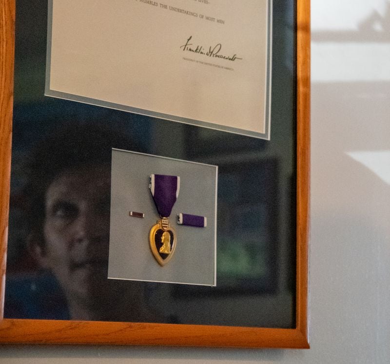 Stephanie Blanchard, granddaughter of Eugene Blanchard, proudly displays her grandfather’s Purple Heart at her residence. Her grandfather, Eugene Blanchard, lost his life at Pearl Harbor on the USS Oklahoma. Thursday, May 27, 2021 in Elizabeth City, NC. MIKE CAUDILL FOR THE ATLANTA JOURNAL-CONSTITUTION 