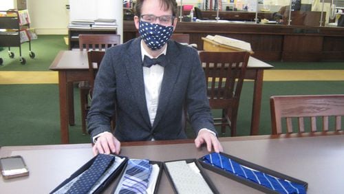 David Russell, reference librarian with the DeKalb County Public Library, started a lending "tiebrary" for those in need of neckwear.