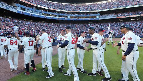 The Braves celebrate winning their final game at Turner Field. Curtis Compton /ccompton@ajc.com