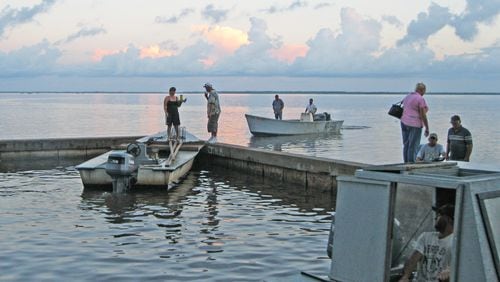 Oystermen head out early in Eastpoint, Fla., for a day of fishing in Apalachicola Bay. DAN CHAPMAN / DCHAPMAN@AJC.COM